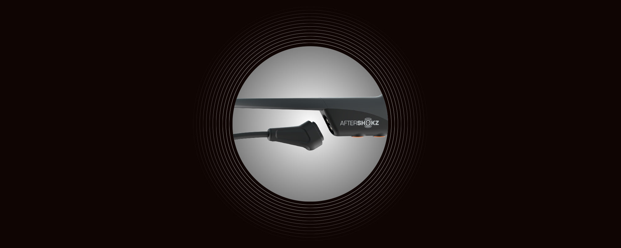 Image of a Magnetic Induction charging port on AfterShokz Aeropex headphones