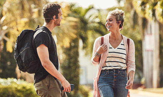 College students wearing Trekz Air and Trekz Titanium headphones