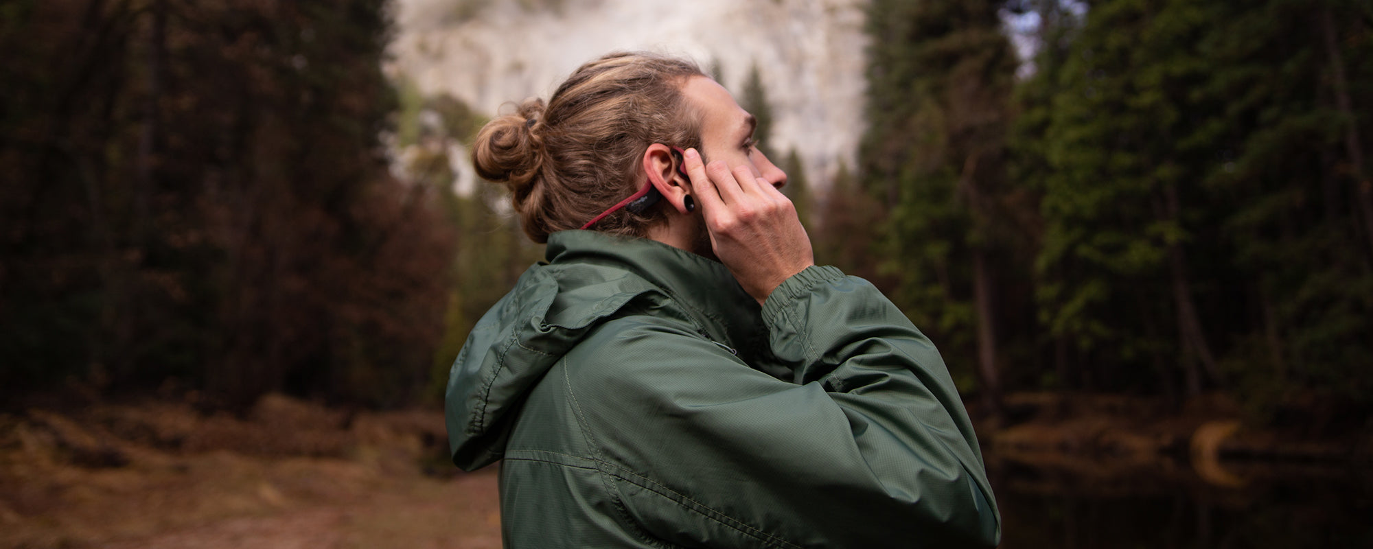 Man resetting AfterShokz Air headphones