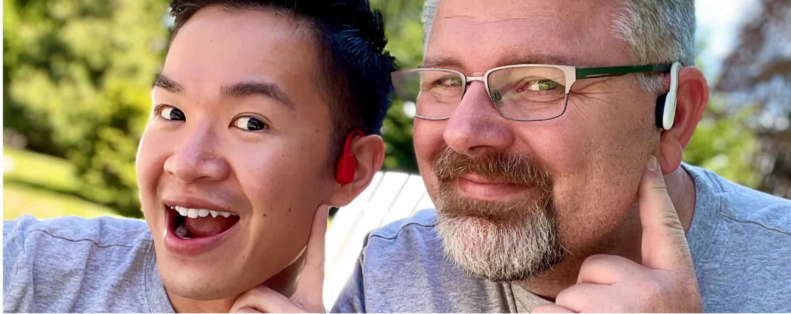 Image of a same-sex male-identifying couple both wearing Shokz wireless headphones