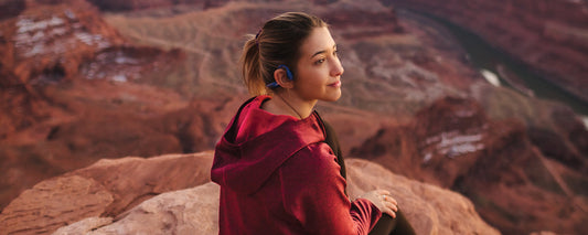 Woman wearing Aeropex practicing meditation
