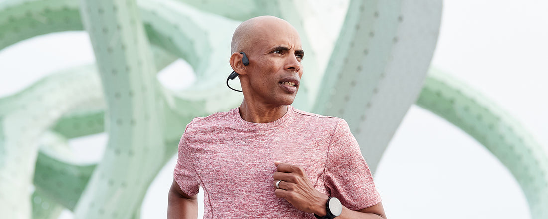 Olympian and AfterShokz Global Ambassador Meb Keflezighi wears Aeropex wireless headphones while running 