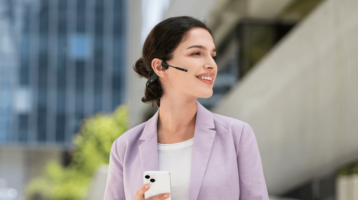 Advanced
Open-Ear Design
Unlike traditional headsets that cover your ears and cut you off from your surroundings, OpenComm2's open-ear design keeps you connected to the world without compromising on comfort or audio quality.
Lightweight and Easy
The OpenComm2 is remarkably light and portable, weighting only 35g.
Effortless Comfort
With a flexible wraparound frame and soft silicone finish, the OpenComm2 delivers easy, effortless, all-day wear.