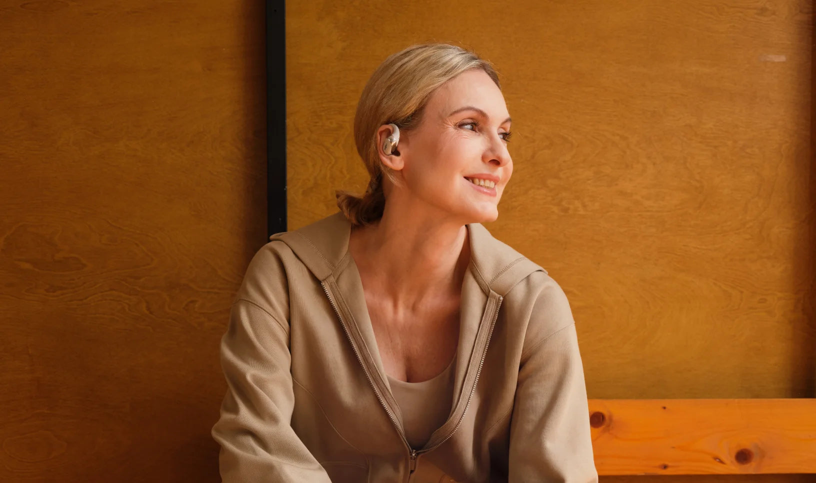 Woman Relaxing Wearing Shokz OPENFIT 2+ Open Earbuds